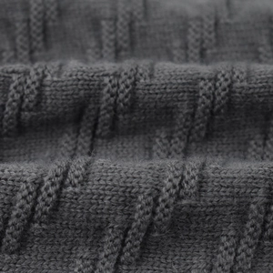 Macro detail of high-quality dark grey knitted fabric with warm fleece texture