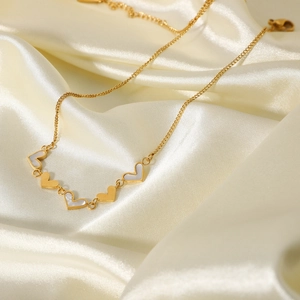 18K gold plated stainless steel necklace with white shell heart pendants on satin