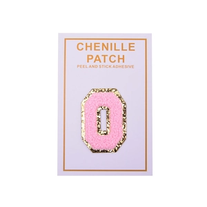 Macro detail of pink chenille letter O patch with gold glitter edge and adhesive backing