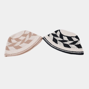 Detailed close-up of handmade crochet hollow rhombus patterns on cotton bucket hats