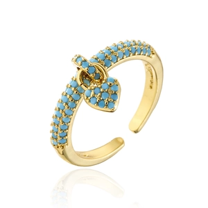 18K gold plated open heart ring with micro-paved blue zircons on white background