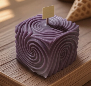 Detail view of purple spiral geometric candle with wave texture on wooden tray