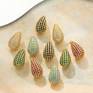 Macro shot of colorful teardrop stud earrings featuring micro-pave cubic zirconia crystals