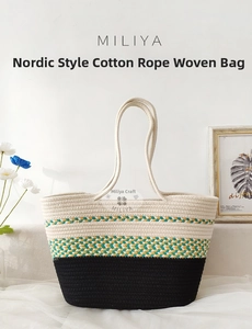 Detail of color-block woven cotton rope tote bag with cream and black textured finish