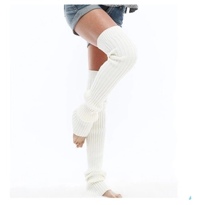 Macro detail of white cable knit leg warmers showing soft ribbed texture and elasticity