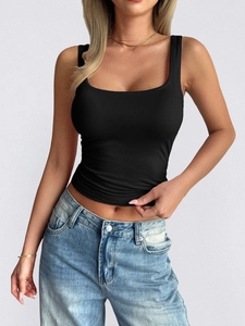 Detail of a black square neck tank top for women styled with light blue jeans