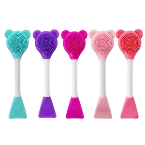 Five assorted colors of dual-ended silicone face brushes with bristles and flat spatulas