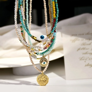 Colorful beaded necklace set with freshwater pearls and evil eye gold coin pendants
