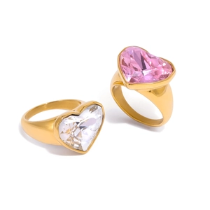 Golden heart-shaped rhinestone rings with pink and clear gemstones on white background