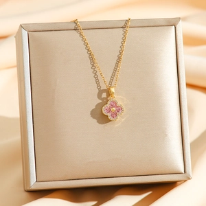 Sparkling pink clover necklace with zircon stones on a gold titanium chain