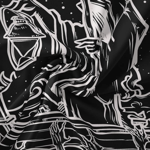 Macro view of gothic black fabric with white lantern and skeleton hand illustrations