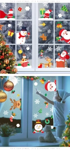 Detail of Christmas window clings featuring Santa and reindeer in a cozy home setting
