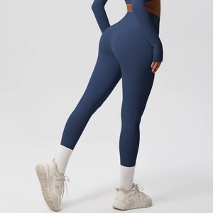 Detail of high-waisted navy yoga leggings with quick-dry fabric and flattering fit