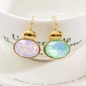 Elegant gold titanium steel earrings with large oval purple and mint green crystals