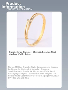 Macro shot of gold stainless steel Mobius ring bracelet with CZ stone and pearl detail