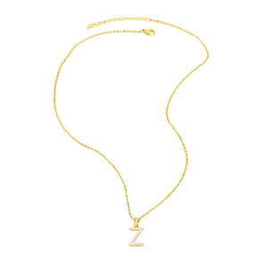 Detail of golden necklace with letter Z pendant inlaid with small white pearls
