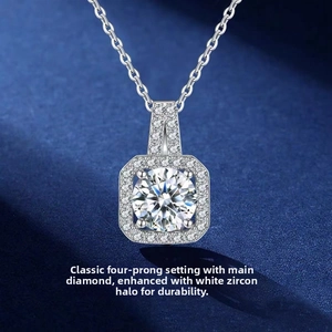 Macro shot of silver halo pendant with four-prong set central cubic zirconia