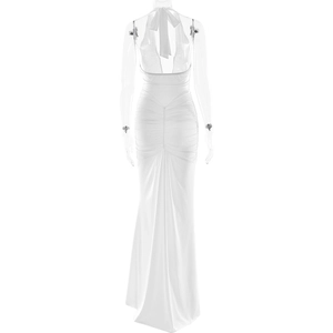 Detail of elegant white halter neck dress featuring ruched waist and mermaid hemline