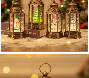 Close-up of four bronze Christmas snow globe lanterns with snowman and tree miniatures