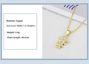 Detailed view of copper 18k gold plated girl pendant with clear cubic zirconia stones