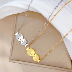 Minimalist titanium steel necklaces with gold and silver kissing fish pendants on satin
