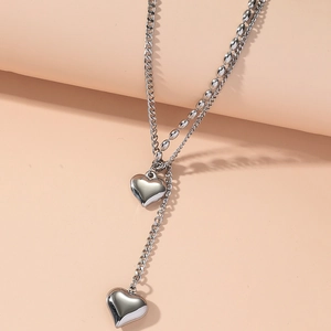 Elegant silver double-layer Y-shaped necklace with polished heart pendants in stainless steel