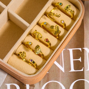 Adjustable gold zodiac ring set with colorful birthstones in a premium jewelry box