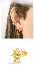 Macro detail of ferris wheel stud earring in copper and titanium with zircon stones