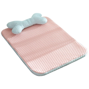 Pink cooling dog mat with breathable texture and blue bone pillow for summer comfort