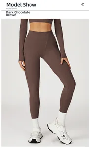 Detail view of high-waisted yoga pants in deep chocolate brown with ergonomic seams