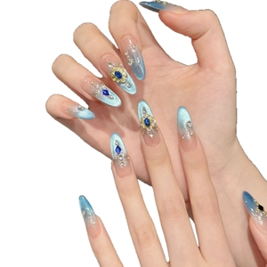 Luxury blue cat-eye press-on nails with royal rhinestones and gold relief details