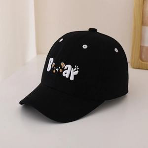 Detail view of the 3D 'Bear' embroidery on the crown of this black cotton baseball cap