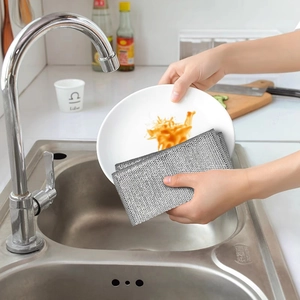 Silver wire dishcloth for kitchen cleaning, scrubbing plates in a stainless steel sink