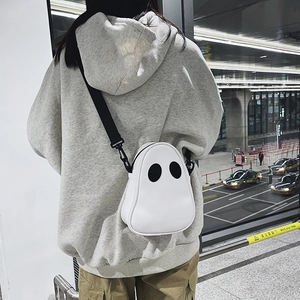 Close-up of cute cartoon ghost crossbody bag in PU leather with adjustable strap