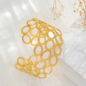 Elegant gold-plated wide open bangle with geometric hollow oval honeycomb pattern design