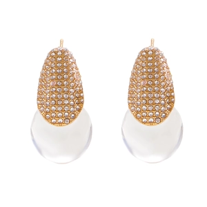 Macro detail of gold teardrop earrings with pave crystals and frosted clear resin spheres