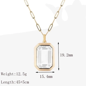 Gold paperclip chain necklace with emerald-cut clear zircon pendant and measurements
