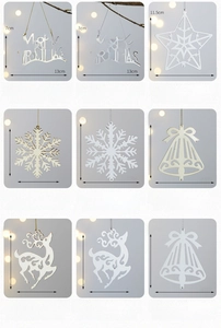 Detailed grid of gold and silver iron Christmas tree ornaments with festive shapes