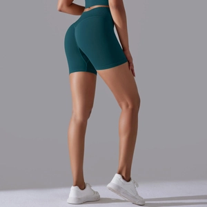 Détail macro du short de yoga sans couture bleu sarcelle à taille haute et effet push-up