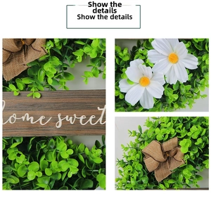 Detailed macro view of artificial boxwood wreath with white daisies and burlap bow