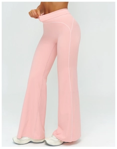 Detail of pink high-waisted flared yoga pants with white contrast side stitching