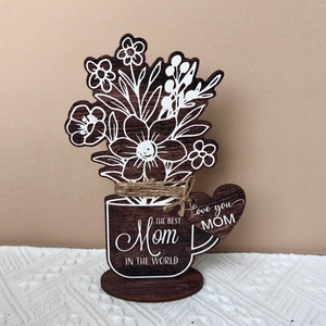 Detail of Mother's Day wooden ornament with floral pattern and The Best Mom text
