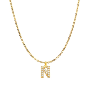Detail shot of a polished gold letter N pendant necklace with shimmering zircon stones