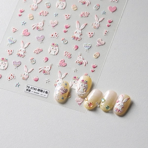 5D embossed rabbit and heart nail art stickers shown on pearly yellow nails