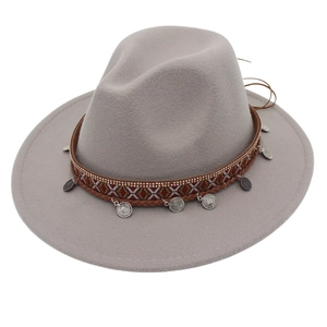 Detail view of wide brim gray felt fedora with ethnic embroidery and metal coin charms