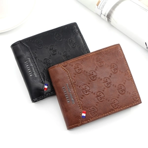 Detail view of MenBense bifold wallets with embossed texture and tricolor ribbon accent