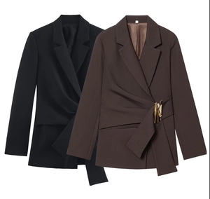 Detailed view of women's blazer set with waist metal buckle belt in black and brown
