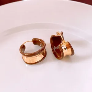 18k gold plated round enamel hoop earrings in minimalist brown and gold design