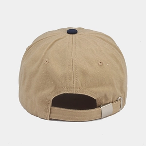 Detail view of khaki cotton baseball cap back with blue top button and metal buckle