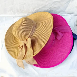 Summer wide-brim straw sun hats in natural and pink with elegant bow ribbon decoration